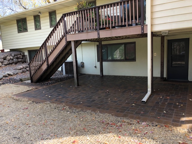 brick paver patio under deck