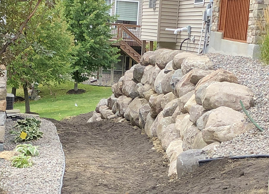 Boulder retaining wall